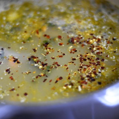 coral lentil soup prep with red pepper flakes